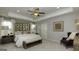 Beautifully furnished main bedroom with elegant decor, plush bedding, and ample space at 1716 Goodwin Dr, Hampton, GA 30228