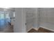 Walk-in pantry featuring wire shelving and access to the kitchen with stainless appliances at 1716 Goodwin Dr, Hampton, GA 30228