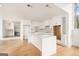 Modern kitchen featuring white cabinets, quartz countertops, a large island, and stainless steel appliances at 3365 Turtle Lake Se Dr, Marietta, GA 30067