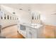 Kitchen island offering seating, surrounded by plenty of natural light from the surrounding windows at 3365 Turtle Lake Se Dr, Marietta, GA 30067