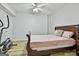 Cozy bedroom with laminate flooring and ample space for workout equipment at 1133 Astoria Ln, Peachtree City, GA 30269