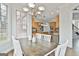 Bright dining area with backyard views, chandelier and access to kitchen at 1133 Astoria Ln, Peachtree City, GA 30269