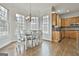 Charming dining area with natural light, chandelier, and kitchen access at 1133 Astoria Ln, Peachtree City, GA 30269