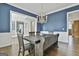 Elegant dining room with a wooden table, wainscoting, and chandelier, blending classic charm and modern style at 1133 Astoria Ln, Peachtree City, GA 30269