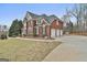 Elegant brick home with a three car garage, basketball court and manicured lawn at 1133 Astoria Ln, Peachtree City, GA 30269
