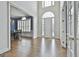 Grand foyer boasting hardwood floors, soaring ceilings, and elegant architectural detailing at 1133 Astoria Ln, Peachtree City, GA 30269
