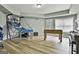 Spacious game room with laminate flooring, offering entertainment possibilities at 1133 Astoria Ln, Peachtree City, GA 30269