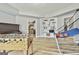 Spacious game room with laminate flooring, featuring a foosball table and basketball hoop at 1133 Astoria Ln, Peachtree City, GA 30269