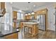 Modern kitchen featuring stainless steel appliances, granite counters, and an island at 1133 Astoria Ln, Peachtree City, GA 30269