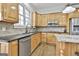 Well-equipped kitchen with stainless steel appliances and ample countertop space at 1133 Astoria Ln, Peachtree City, GA 30269