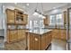 Spacious kitchen with island, breakfast bar, granite countertops, and stainless appliances at 1133 Astoria Ln, Peachtree City, GA 30269