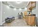 Basement kitchenette with wooden cabinets and tiled floors at 1133 Astoria Ln, Peachtree City, GA 30269