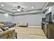 Comfortable living room featuring laminate floors, gray walls, and recessed lighting at 1133 Astoria Ln, Peachtree City, GA 30269
