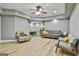 Stylish living room showcasing light laminate flooring and contemporary gray walls at 1133 Astoria Ln, Peachtree City, GA 30269