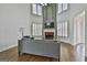 Spacious living room features a fireplace, vaulted ceilings, and ample natural light, ideal for relaxation and entertainment at 1133 Astoria Ln, Peachtree City, GA 30269
