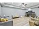 Comfortable living room featuring laminate floors, gray walls, recessed lighting, and a ceiling fan at 1133 Astoria Ln, Peachtree City, GA 30269