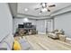 Bright living room with laminate floors, ceiling fan, recessed lights and access to the backyard at 1133 Astoria Ln, Peachtree City, GA 30269