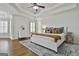 Spacious main bedroom has a tray ceiling, ceiling fan and plantation shutters at 1133 Astoria Ln, Peachtree City, GA 30269