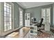 Bright home office with French doors, hardwood floors, and ample natural light, perfect for a productive workspace at 1133 Astoria Ln, Peachtree City, GA 30269