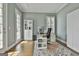 Sunlit home office with French doors, built-in shelving, and a bright, airy ambiance for productivity at 1133 Astoria Ln, Peachtree City, GA 30269
