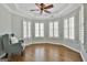 Sitting area has a cozy chair, lots of natural light and hardwood floors at 1133 Astoria Ln, Peachtree City, GA 30269