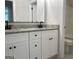 Bathroom features double vanity with granite countertop and ample storage for spa-like experience at 240 Jay Trl, Fayetteville, GA 30215