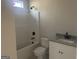 Clean bathroom with modern fixtures including a shower-tub combination and granite countertop at 240 Jay Trl, Fayetteville, GA 30215