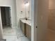 Bathroom boasts granite countertops, double vanity, and modern finishes for spa-like experience at 240 Jay Trl, Fayetteville, GA 30215
