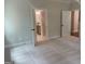 Spacious bedroom featuring neutral carpeting and ensuite bathroom access for modern living at 240 Jay Trl, Fayetteville, GA 30215