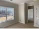 Natural light brightens this bedroom highlighting the blank canvas awaiting personal touches at 240 Jay Trl, Fayetteville, GA 30215