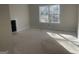 Sunlit bedroom with a large window and under-floor HVAC, awaiting personalized finishing touches at 240 Jay Trl, Fayetteville, GA 30215