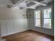 Elegant dining room with hardwood floors, wainscoting, and coffered ceiling with chandelier at 240 Jay Trl, Fayetteville, GA 30215