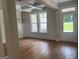 Elegant dining room with hardwood floors, wainscoting, and coffered ceiling with chandelier at 240 Jay Trl, Fayetteville, GA 30215