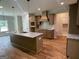 Modern kitchen featuring granite countertops, stainless faucet and backsplash at 240 Jay Trl, Fayetteville, GA 30215