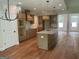 Bright kitchen with stainless appliances, granite countertops and hardwood floors at 240 Jay Trl, Fayetteville, GA 30215
