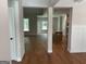 Open-concept living space featuring hardwood floors and abundant natural light from large windows at 240 Jay Trl, Fayetteville, GA 30215