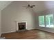Spacious living room features hardwood floors, stone fireplace and vaulted ceilings at 240 Jay Trl, Fayetteville, GA 30215