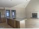 The kitchen island and fireplace are focal points in this home with an open-concept living space at 240 Jay Trl, Fayetteville, GA 30215