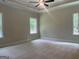 Main bedroom with tray ceilings, plush carpeting and ample natural light at 240 Jay Trl, Fayetteville, GA 30215