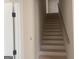 Stairway featuring natural wood steps lead to upper level awaiting your personal touch at 240 Jay Trl, Fayetteville, GA 30215