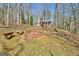 Brick fire pit with benches surrounded by trees at 150 Gill Ln, Stockbridge, GA 30281