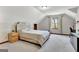 Bright bedroom featuring natural light, neutral colors, and soft carpet at 150 Gill Ln, Stockbridge, GA 30281