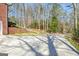A view of the paved driveway and landscaping on the property at 150 Gill Ln, Stockbridge, GA 30281