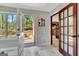 Bright entryway with tile flooring, showcasing natural light and easy access to outdoor patio and interior spaces at 150 Gill Ln, Stockbridge, GA 30281