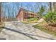 Brick home with a large driveway and covered porch at 150 Gill Ln, Stockbridge, GA 30281