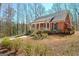 Charming brick home featuring a covered front porch and a well-manicured front yard at 150 Gill Ln, Stockbridge, GA 30281