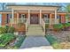 Welcoming front entrance showcasing a newly renovated porch, wood railings, and a solid front door at 150 Gill Ln, Stockbridge, GA 30281