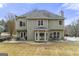 Back exterior with multi-level patio, ideal for outdoor gatherings and relaxation at 2715 Ivey Crossing Trl, Cumming, GA 30041