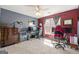 Bedroom with a desk setup, gaming chair, and large window with natural light at 2715 Ivey Crossing Trl, Cumming, GA 30041