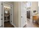 Entryway view featuring half bath and front door with transom window at 2715 Ivey Crossing Trl, Cumming, GA 30041